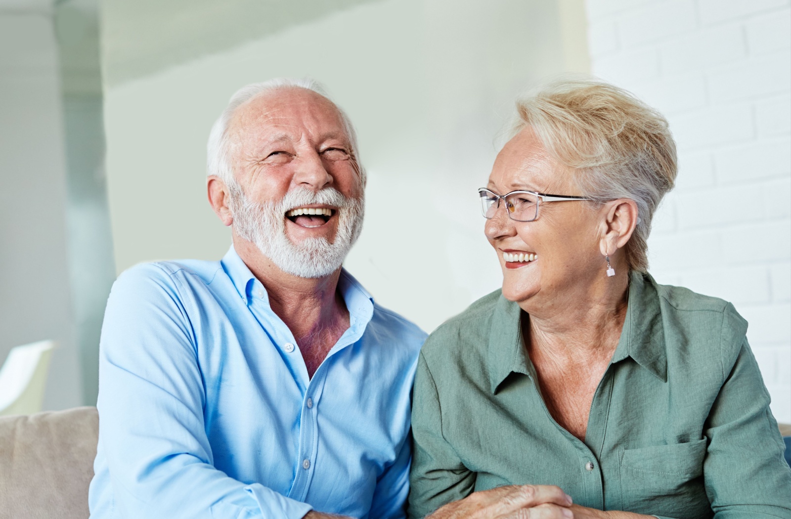 A senior couple enjoying each other's company, sharing a warm and familiar moment together.